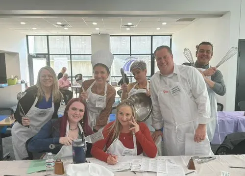 A group of community volunteers gets ready to serve up something good.