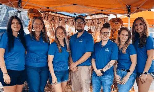 Alexis Goines, Justin Washvill, and the Goines Agency team bring smiles and seasonal fun to a Halloween community event.