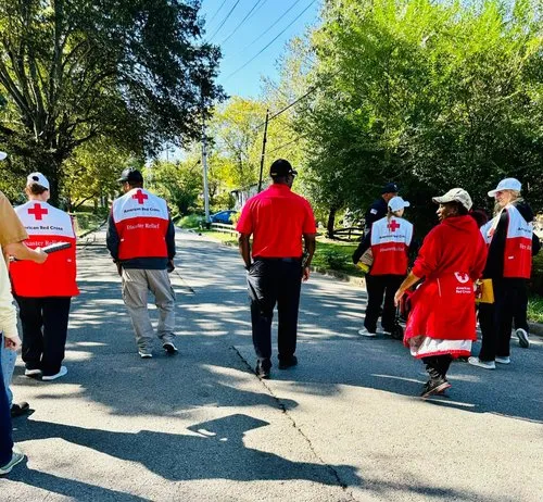 American Red Cross volunteers walk together through a neighborhood as they serve local families.